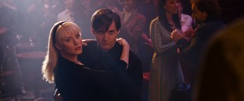 Movie still from “Spider-Man 3” (2007), directed by Sam Raimi – A man and a woman standing next to each other in a room; Medium shot, Over the shoulder angle