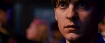 Movie still from “Spider-Man 3” (2007), directed by Sam Raimi – A person's face with a blurry background; Extreme Close Up shot, High angle