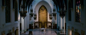 Movie still from “Spider-Man 3” (2007), directed by Sam Raimi – A large church with a cross on the wall; Extreme Wide shot, Low angle