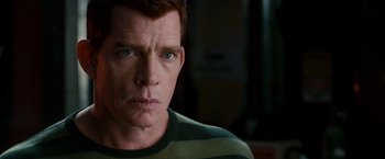 Movie still from “Spider-Man 3” (2007), directed by Sam Raimi – A person wearing a striped sweater; Close Up shot, Over the shoulder angle