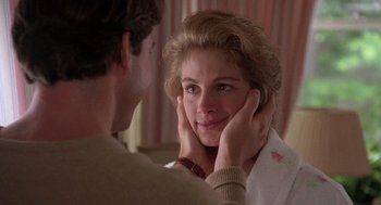Movie still from “Steel Magnolias” (1989), directed by Herbert Ross – A man and a woman looking at each other in front of a mirror; Close Up shot, Over the shoulder angle