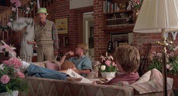 Movie still from “Steel Magnolias” (1989), directed by Herbert Ross – A group of people sitting in a living room; Wide shot, Over the shoulder angle