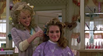 Movie still from “Steel Magnolias” (1989), directed by Herbert Ross – A young girl getting her hair done by a woman; Close Up shot, Over the shoulder angle