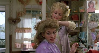 Movie still from “Steel Magnolias” (1989), directed by Herbert Ross – A woman getting her hair done by a stylist; Medium shot, Over the shoulder angle