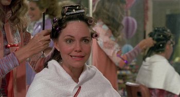 Movie still from “Steel Magnolias” (1989), directed by Herbert Ross – A woman is getting her hair done in a hair salon; Close Up shot, Over the shoulder angle