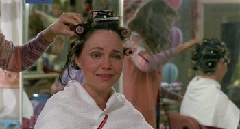 Movie still from “Steel Magnolias” (1989), directed by Herbert Ross – A woman is getting her hair done by a stylist; Close Up shot, Over the shoulder angle