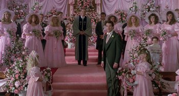 Movie still from “Steel Magnolias” (1989), directed by Herbert Ross – A group of people standing in front of a wedding; Wide shot, High angle