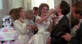 Movie still from “Steel Magnolias” (1989), directed by Herbert Ross – A group of people standing in a room; Medium shot, Over the shoulder angle