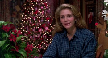 Movie still from “Steel Magnolias” (1989), directed by Herbert Ross – A woman sitting in front of a christmas tree; Close Up shot, Over the shoulder angle