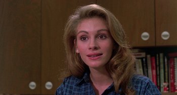 Movie still from “Steel Magnolias” (1989), directed by Herbert Ross – A person wearing a plaid shirt; Close Up shot, Over the shoulder angle