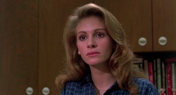 Movie still from “Steel Magnolias” (1989), directed by Herbert Ross – A person with long hair; Close Up shot, Over the shoulder angle