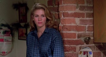 Movie still from “Steel Magnolias” (1989), directed by Herbert Ross – A woman standing in front of a brick wall; Close Up shot, Over the shoulder angle