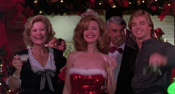 Movie still from “Steel Magnolias” (1989), directed by Herbert Ross – A group of people standing next to each other in a room; Medium shot, Low angle