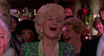 Movie still from “Steel Magnolias” (1989), directed by Herbert Ross – An older woman is laughing with her mouth open; Close Up shot, Low angle
