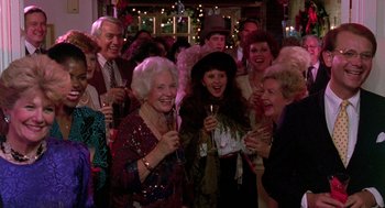 Movie still from “Steel Magnolias” (1989), directed by Herbert Ross – A group of older people are gathered together for a party; Medium shot, High angle