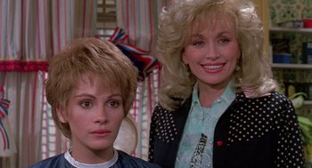 Movie still from “Steel Magnolias” (1989), directed by Herbert Ross – A woman with short hair and a woman with blonde hair; Close Up shot, Over the shoulder angle
