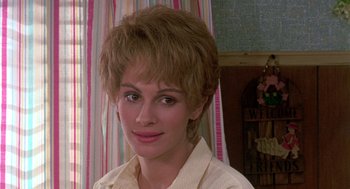 Movie still from “Steel Magnolias” (1989), directed by Herbert Ross – A person with short hair; Close Up shot, Over the shoulder angle