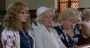 Movie still from “Steel Magnolias” (1989), directed by Herbert Ross – A group of women standing next to each other in a church; Close Up shot, Low angle