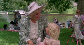 Movie still from “Steel Magnolias” (1989), directed by Herbert Ross – An older woman sitting next to a little girl; Medium shot, Over the shoulder angle