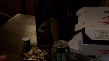 Movie still from “Breaking Bad” (2008), created by Vince Gilligan – A can of soda and a can of beer on a table; Extreme Close Up shot, High angle