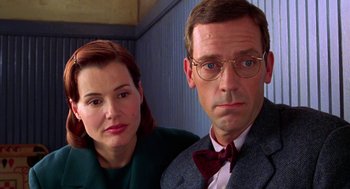 Movie still from “Stuart Little” (1999), directed by Rob Minkoff – A man and a woman standing next to each other; Close Up shot, Over the shoulder angle