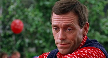 Movie still from “Stuart Little” (1999), directed by Rob Minkoff – A person wearing a red and white scarf; Close Up shot, Over the shoulder angle