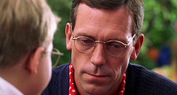 Movie still from “Stuart Little” (1999), directed by Rob Minkoff – A person wearing glasses; Close Up shot, Over the shoulder angle