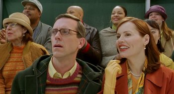 Movie still from “Stuart Little 2” (2002), directed by Rob Minkoff – A group of people sitting next to each other in a room; Close Up shot, Over the shoulder angle