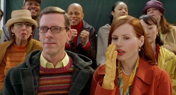 Movie still from “Stuart Little 2” (2002), directed by Rob Minkoff – A group of people standing around each other in a room; Close Up shot, Over the shoulder angle