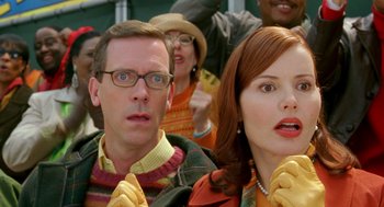 Movie still from “Stuart Little 2” (2002), directed by Rob Minkoff – A group of people standing next to each other; Close Up shot, Over the shoulder angle