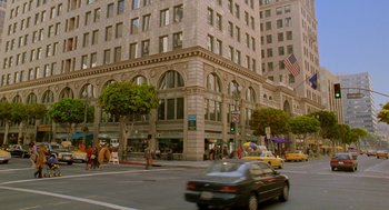 Movie still from “Stuart Little 2” (2002), directed by Rob Minkoff – A busy city street with cars driving down the road; Extreme Wide shot, High angle