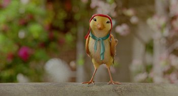 Movie still from “Stuart Little 2” (2002), directed by Rob Minkoff – A yellow bird with a red hat and a blue scarf; Extreme Close Up shot, Low angle