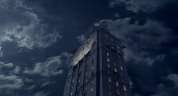 Movie still from “Stuart Little 2” (2002), directed by Rob Minkoff – A tall building with a clock on the top of it; Extreme Wide shot, Low angle