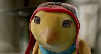 Movie still from “Stuart Little 2” (2002), directed by Rob Minkoff – A stuffed bird wearing a hat; Extreme Close Up shot, High angle