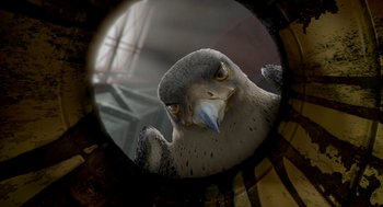 Movie still from “Stuart Little 2” (2002), directed by Rob Minkoff – The head of a bird looking into a mirror; Extreme Close Up shot, Low angle