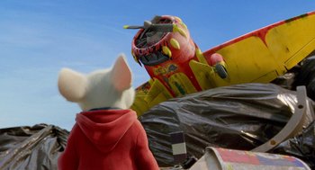 Movie still from “Stuart Little 2” (2002), directed by Rob Minkoff – A mouse looking at an airplane in the sky; Wide shot, Over the shoulder angle