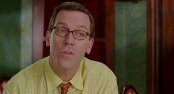 Movie still from “Stuart Little 2” (2002), directed by Rob Minkoff – A person wearing glasses and a tie; Close Up shot, Over the shoulder angle