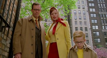 Movie still from “Stuart Little 2” (2002), directed by Rob Minkoff – A man , woman , and boy dressed up for a costume party; Medium shot, Low angle