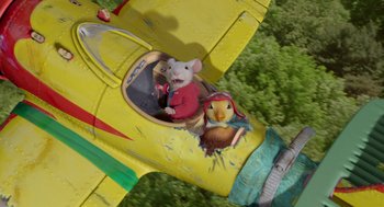Movie still from “Stuart Little 2” (2002), directed by Rob Minkoff – Two mice are sitting in the cockpit of an airplane; Wide shot, Overhead angle