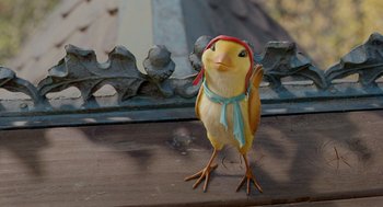 Movie still from “Stuart Little 2” (2002), directed by Rob Minkoff – A small yellow bird with a red hat and scarf; Extreme Close Up shot, High angle