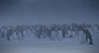 Movie still from “Surf's Up” (2007), directed by Chris Buck – A large group of penguins standing in the snow; Extreme Wide shot, High angle
