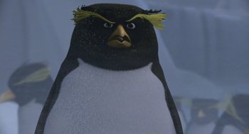 Movie still from “Surf's Up” (2007), directed by Chris Buck – An animated penguin with a yellow beak and yellow eyes; Extreme Close Up shot, Low angle