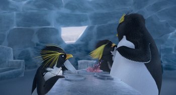 Movie still from “Surf's Up” (2007), directed by Chris Buck – A group of penguins sitting at a dining table; Medium shot, High angle