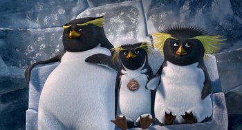 Movie still from “Surf's Up” (2007), directed by Chris Buck – A group of three penguins standing next to each other; Medium shot, High angle