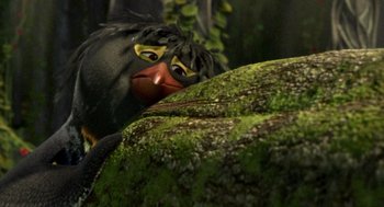 Movie still from “Surf's Up” (2007), directed by Chris Buck – A black bird with yellow eyes is sitting next to a tree trunk; Close Up shot, High angle