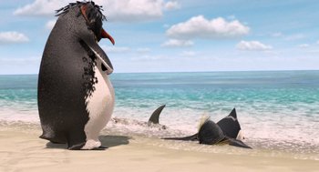 Movie still from “Surf's Up” (2007), directed by Chris Buck – A penguin and two sharks on the beach; Wide shot, High angle