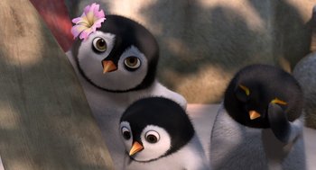 Movie still from “Surf's Up” (2007), directed by Chris Buck – A group of penguins with a pink flower in their mouth; Close Up shot, Low angle