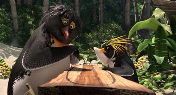 Movie still from “Surf's Up” (2007), directed by Chris Buck – Two birds sitting next to each other on top of a tree stump; Medium shot, High angle