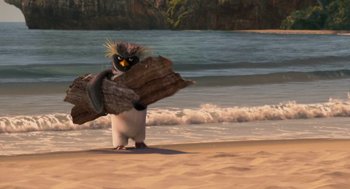 Movie still from “Surf's Up” (2007), directed by Chris Buck – A penguin that is holding a piece of driftwood; Wide shot, Low angle