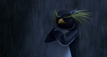 Movie still from “Surf's Up” (2007), directed by Chris Buck – A stuffed animal penguin with a yellow beak and feathers on it's head; Close Up shot, Low angle